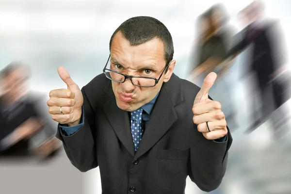 Young silly business man going thumbs up — Stock Photo, Image