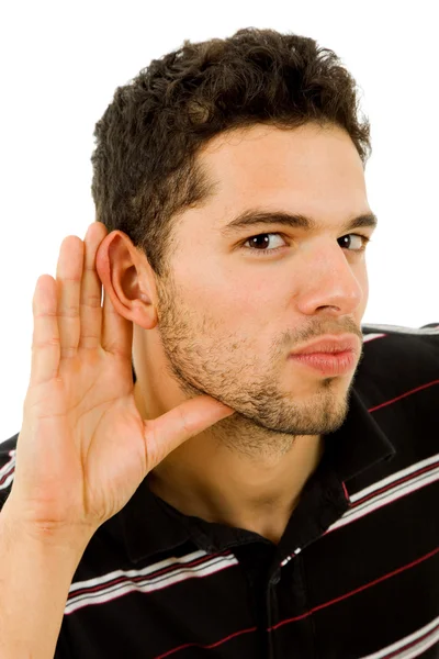 Young man with open hand, earing something — Stock Photo, Image