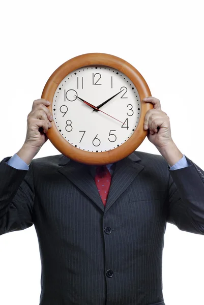 Caucásico hombre usando traje celebración reloj en la cabeza —  Fotos de Stock