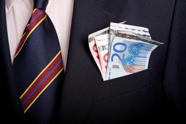 Sommige bankbiljetten in business man zak — Stockfoto