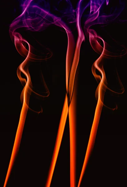 Abstract colored smoke on a black background — Stock Photo, Image