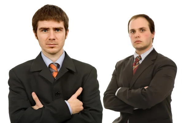 Dois jovens homens de negócios retrato em branco, foco no homem de esquerda — Fotografia de Stock