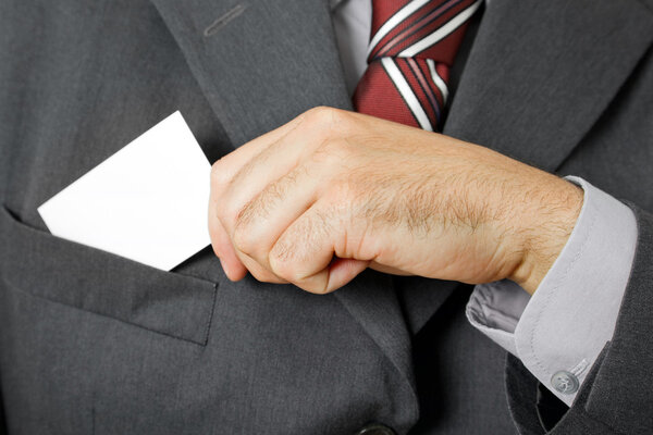 Hand of business man with business card