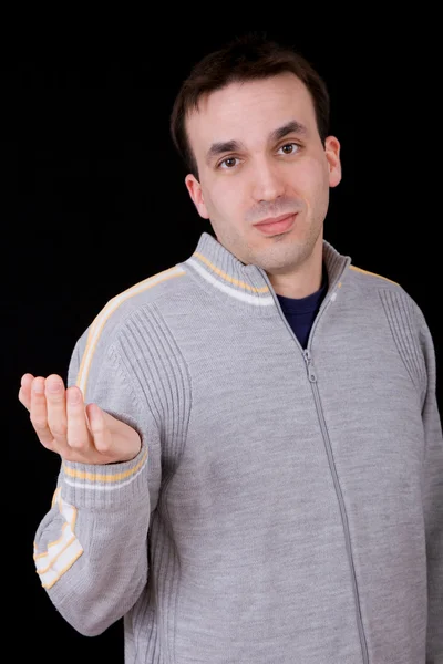 Jovem casual homem pensando no fundo preto — Fotografia de Stock