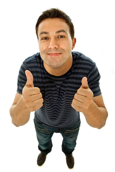 Jovem homem casual indo polegares para cima em um fundo branco — Fotografia de Stock