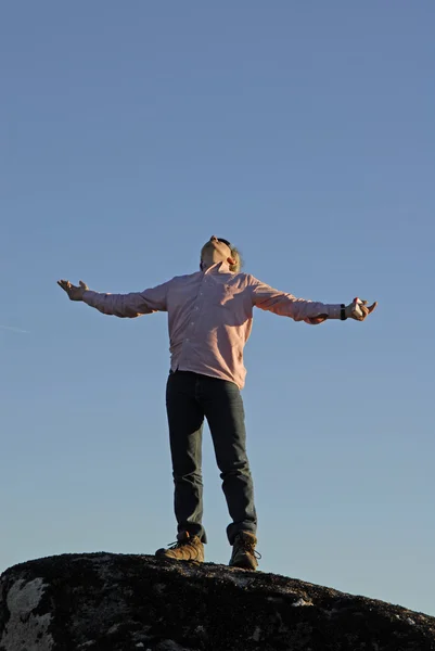 Young man with arms wide open — Stock Photo, Image