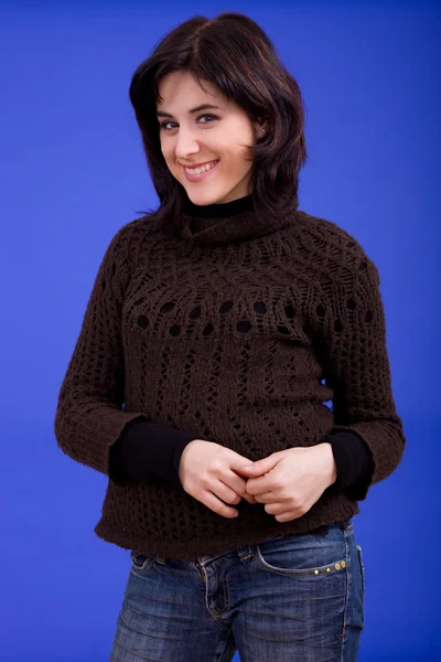 Young beautiful woman, on a blue background — Stock Photo, Image