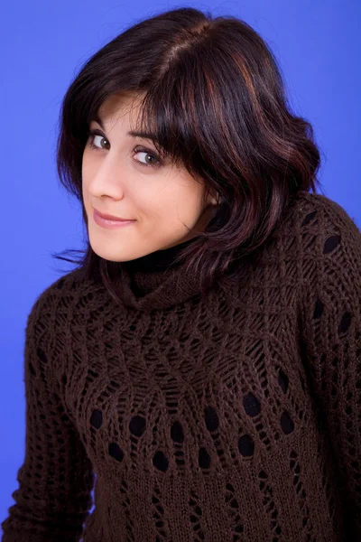 Young beautiful woman, on a blue background — Stock Photo, Image