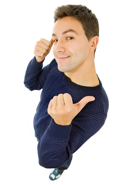 Casual jongeman duimen omhoog in een witte a — Stockfoto