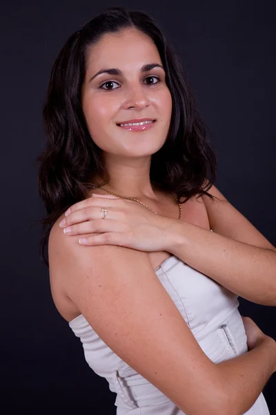 Young beautiful brunette portrait against black background — Stock Photo, Image