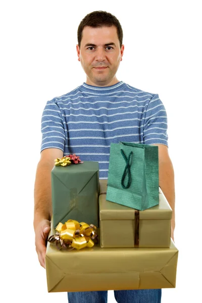 Young casual man holding a few gifts, isolated — Stock Photo, Image