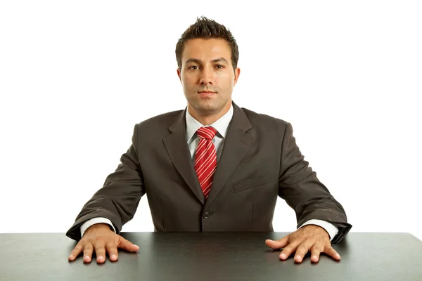 Jonge zakenman op een bureau, geïsoleerd op wit — Stockfoto