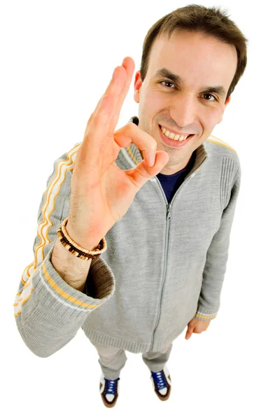 Joven feliz con la mano ganadora aislada en blanco —  Fotos de Stock