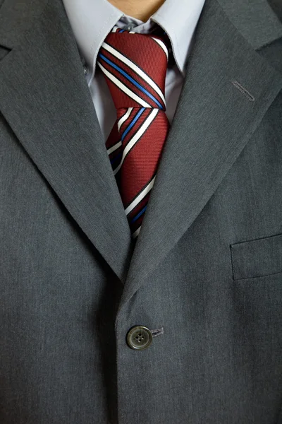 Detalhe de um terno de homem de negócios com gravata colorida — Fotografia de Stock