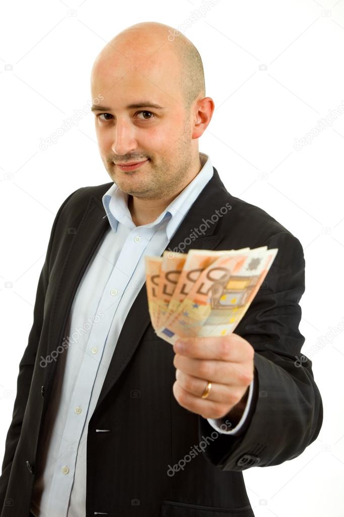 Young business man with money, isolated on white background