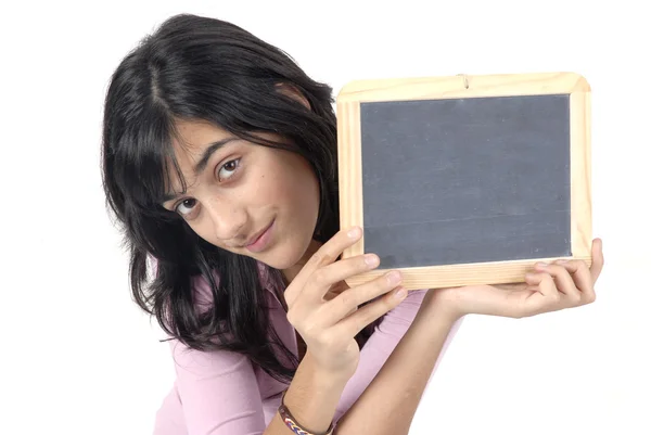 Young girl with a blackboard in a white background — Stock Photo, Image