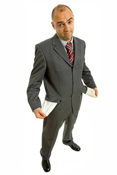 Hombre sosteniendo su bolsillo vacío, aislado en blanco — Foto de Stock