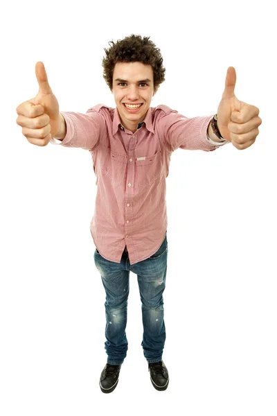 Молодой человек делает большие пальцы вверх на белом фоне — стоковое фото