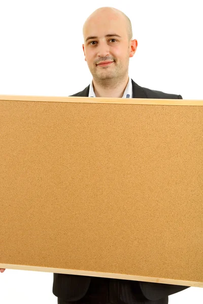 Jovem homem casual, segurando um cartaz, isolado em branco — Fotografia de Stock