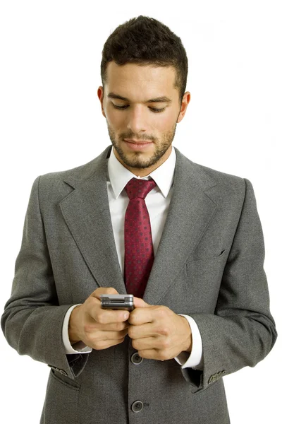彼の携帯電話を探している若いビジネスマン — ストック写真