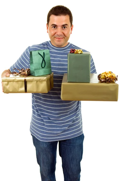 Jovem homem casual segurando alguns presentes — Fotografia de Stock
