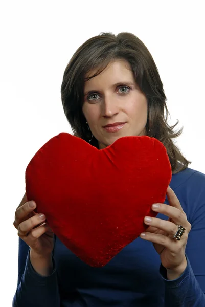 Mooie jonge vrouw met een hart valentines — Stockfoto