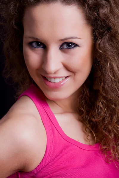 Young beautiful brunette portrait against black background — Stock Photo, Image