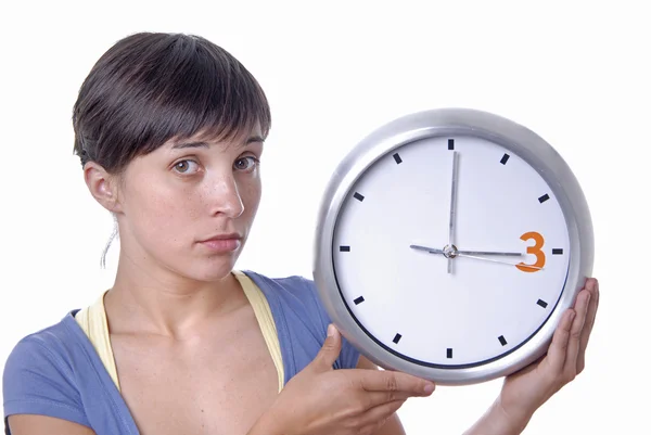 Caucasian young woman holding a big clock — Stock Photo, Image