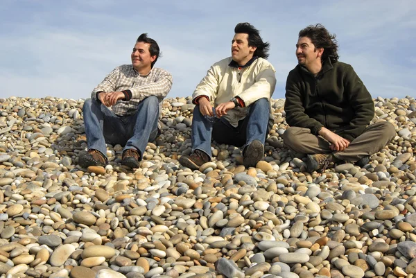 Three casual young men at the beach — Stock Photo, Image
