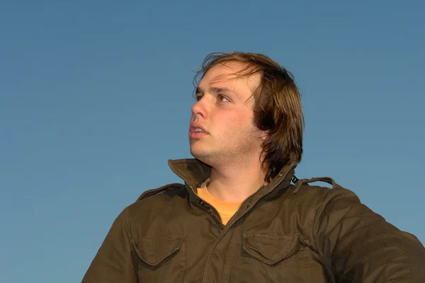 Young man portrait with the sky as background — Stock Photo, Image