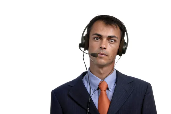 Joven hombre del centro de llamadas hablando por teléfono — Foto de Stock