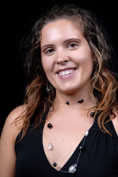 Young woman posing in black background in casual clothes — Stock Photo, Image