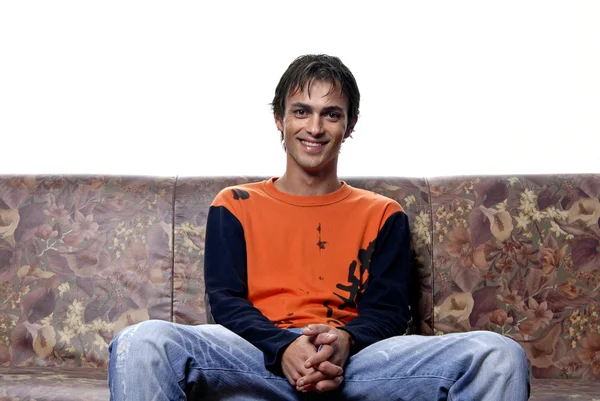 Young casual man portrait in a sofa — Stock Photo, Image