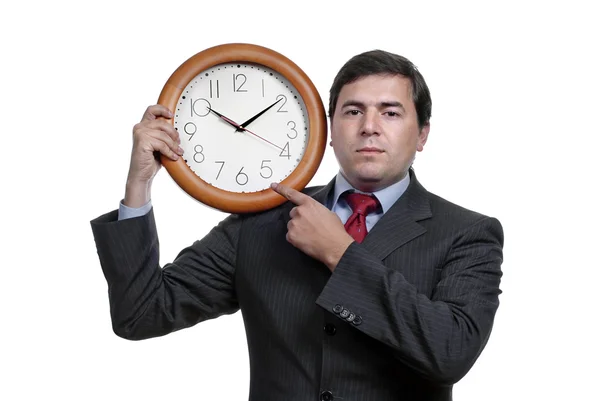 A handsome business man holding a clock — Stock Photo, Image