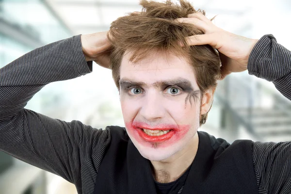 Crazy young man dressed as joker — Stock Photo, Image