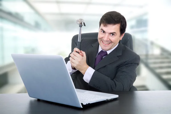 Young happy business man with a hammer — Stock Photo, Image