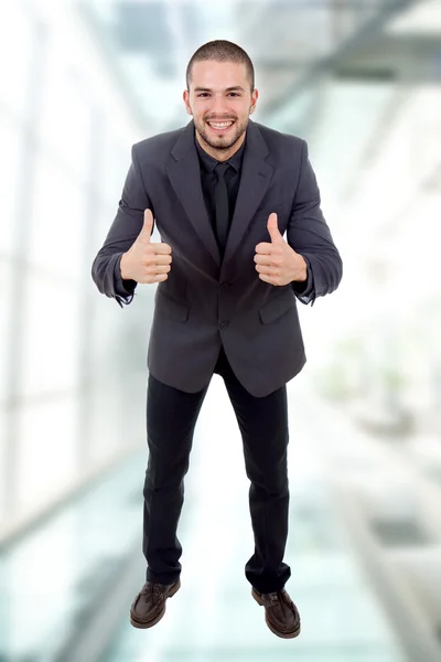 Young business man going thumbs up — Stock Photo, Image