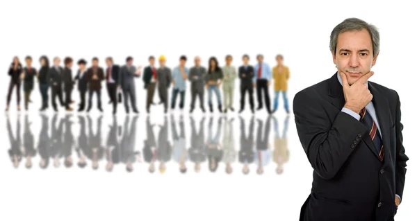 Business man in front of a group of — Stock Photo, Image
