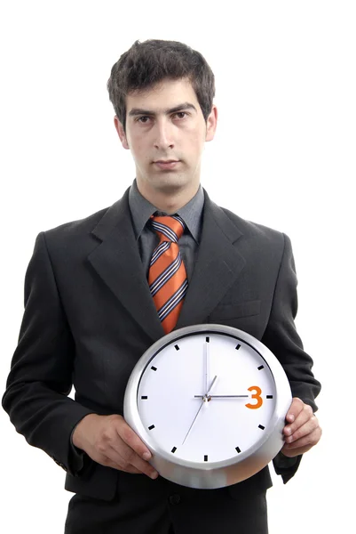 Joven hombre de negocios guapo sosteniendo un reloj — Foto de Stock