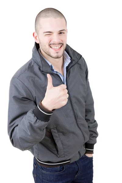 Young casual man going thumb up — Stock Photo, Image