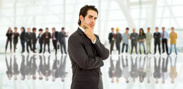 Business man in front of a group of — Stock Photo, Image