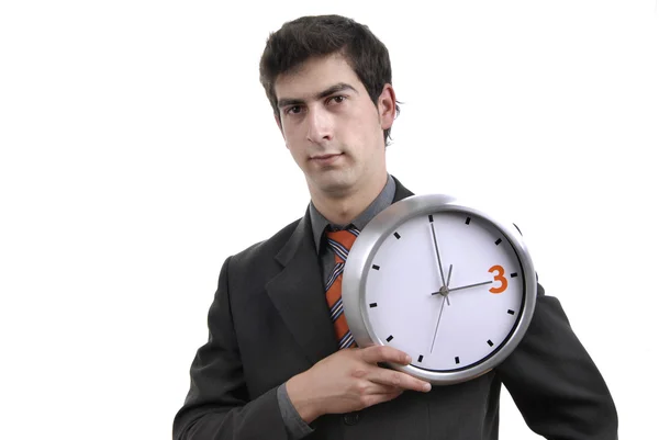 Joven hombre de negocios guapo sosteniendo un reloj — Foto de Stock