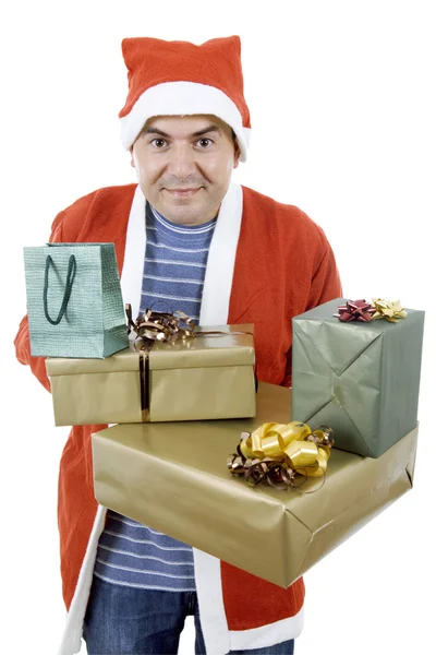 Jeune homme avec chapeau de Père Noël tenant quelques cadeaux — Photo