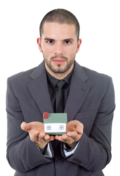 Young businessman with a small house in his hand — Stock Photo, Image