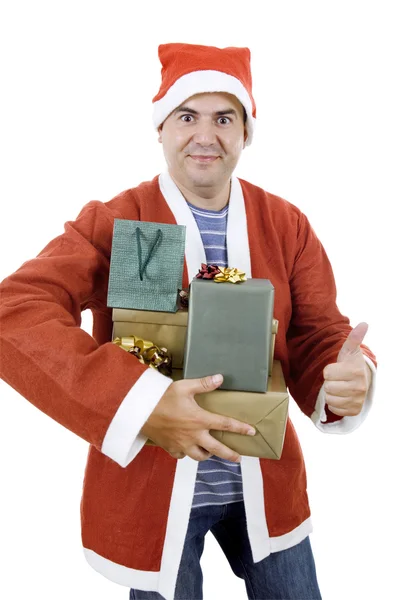 Jovem com chapéu de Pai Natal segurando alguns presentes — Fotografia de Stock