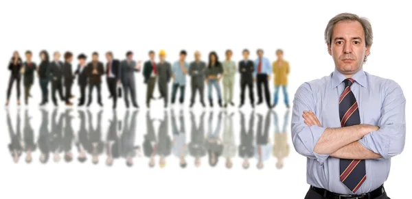 Business man in front of a group of — Stock Photo, Image