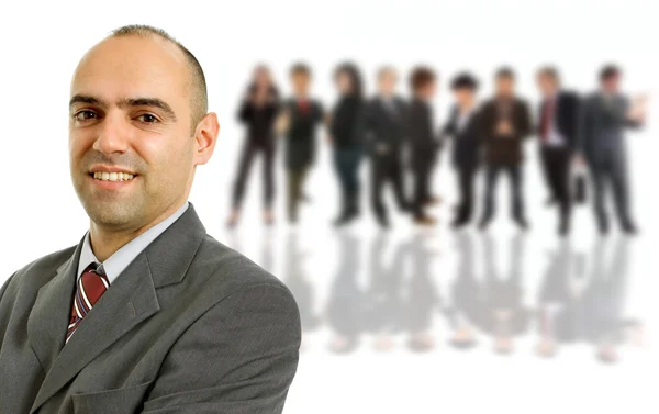 Happy business man in front of a group of — Stock Photo, Image