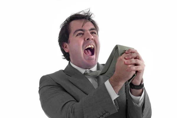 Jovem homem de negócios gritando e puxando sua gravata — Fotografia de Stock