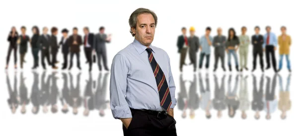 Business man in front of a group of — Stock Photo, Image