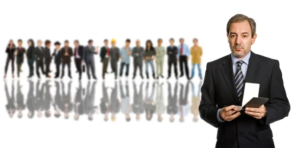 Business man in front of a group of — Stock Photo, Image